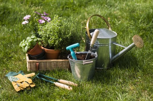 Front view of a well-maintained Wood Green garden entrance with tools set out