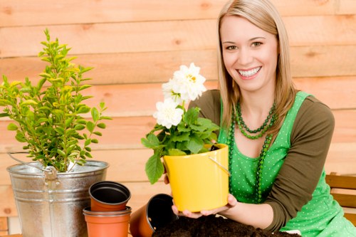 Workers wearing protective equipment during garden maintenance